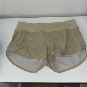 size 10 green/tan lululemon shorts